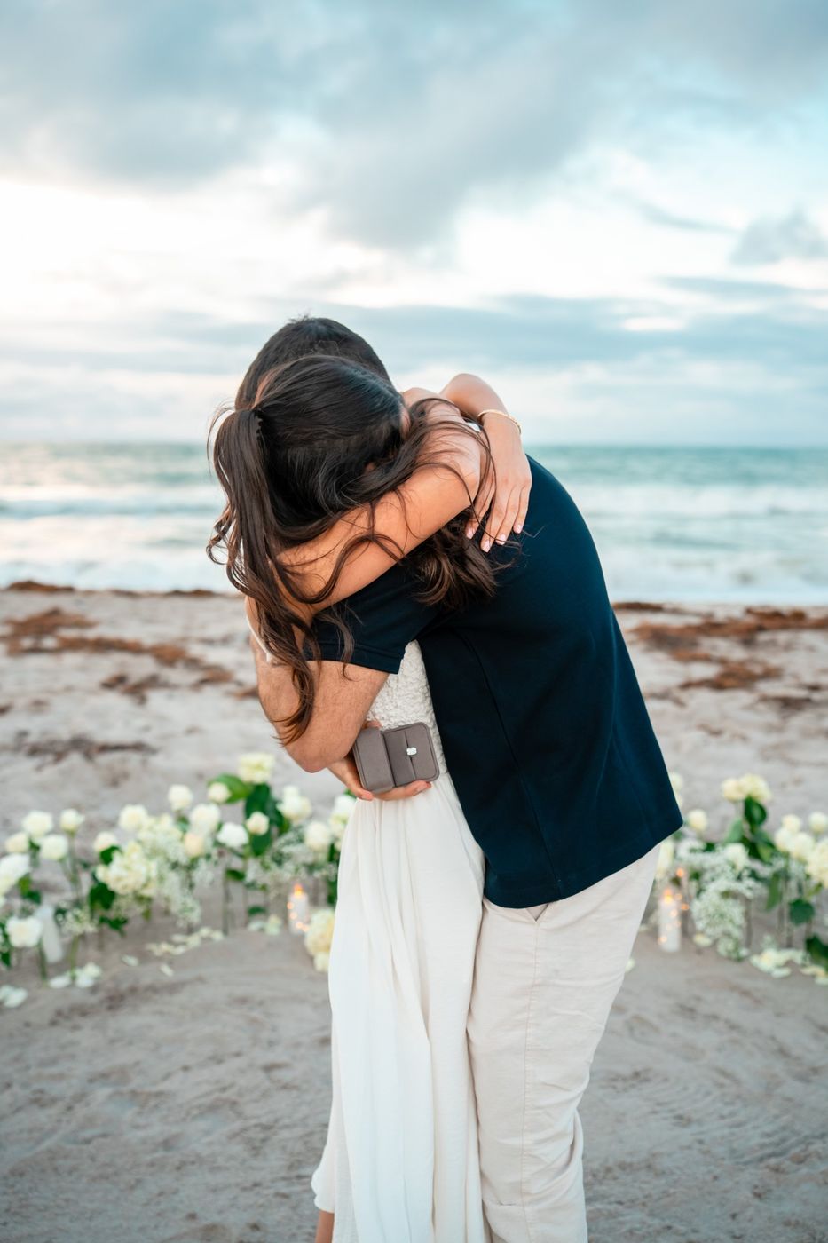 Talya and Sahar embracing on the beach